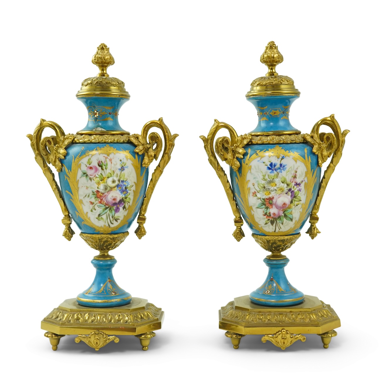 A pair of late 19th century ormolu mounted Sevres style porcelain cassolettes